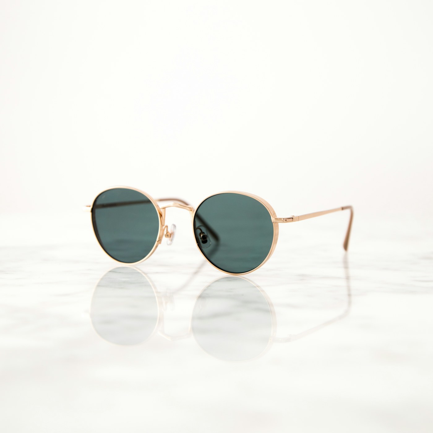 Woman trying on classic sunglasses in natural outdoor light